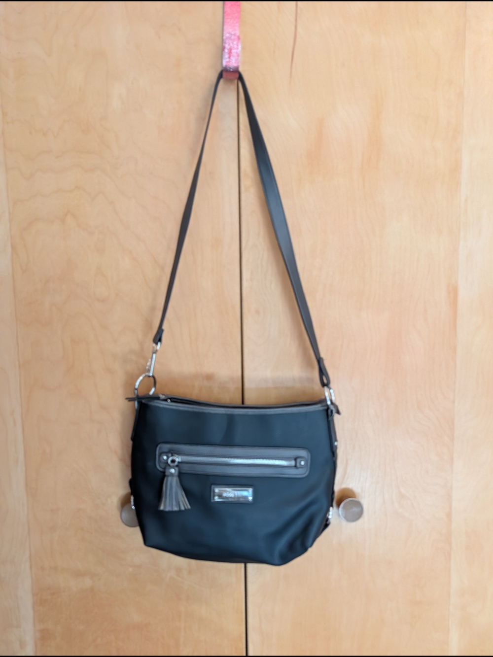 Rosetti black pebbled faux-leather crossbody bag With Tassel Zipper Pull